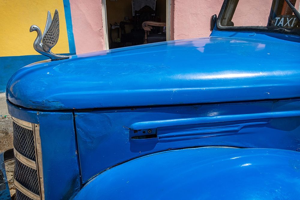 Detail of classic blue American car with chrome swan hood ornament in Trinidad-Cuba